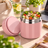 Pot repas isotherme rose ouvert contenant une salade composée, avec son couvercle à côté